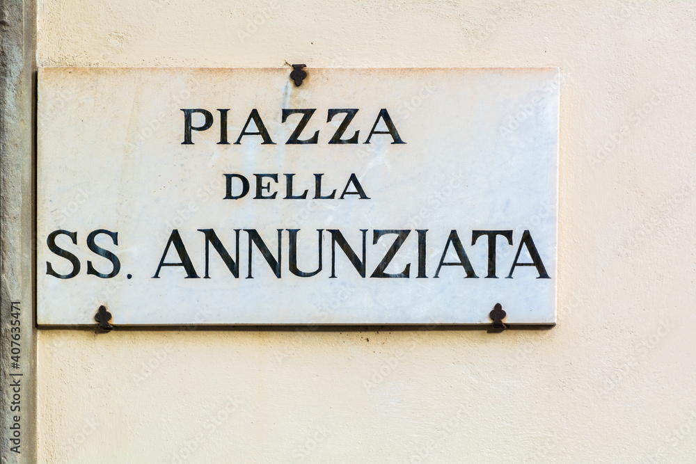 Piazza della SS. Annunziata street sign on the wall in Florence, Italy Piazza della SS. Annunziata street sign on the wall in Florence, Italy