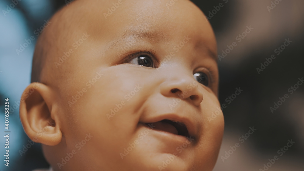 Portrait of adorable curious multiracial dark skin baby looking up. . High quality photo Portrait of adorable curious multiracial dark skin baby looking up. . High quality photo