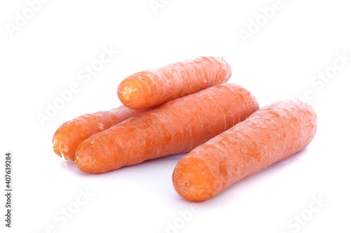 Fresh organic carrots on white background.