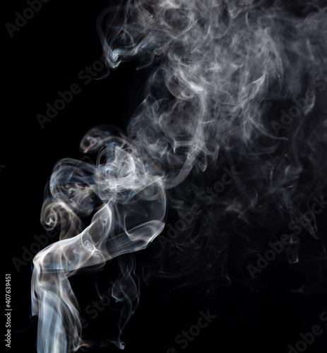 Smoke isolated on black background. © schankz