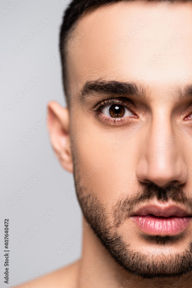 close up view of bearded hispanic man looking at camera isolated on grey close up view of bearded hispanic man looking at camera isolated on grey