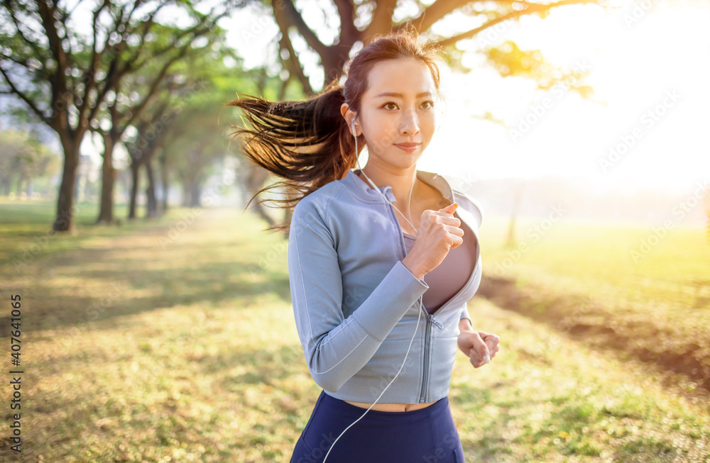 young woman running in the park at morning young woman running in the park at morning
