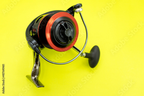 A variety of fishing reels. Fishing gear and accessories. Demo samples are hanging on a display case.