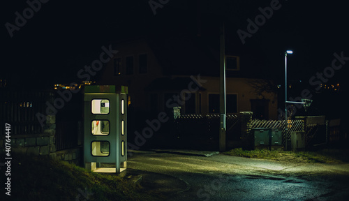 night telephone booth. mystical and mysterious street phone. dangerous place on an empty street