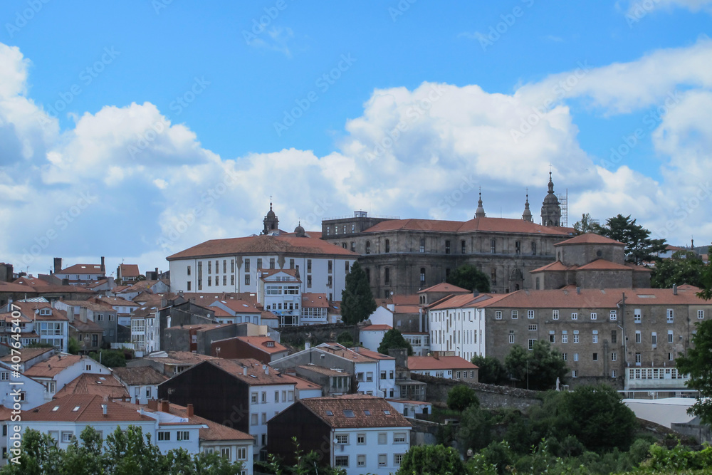 View of Santiago de Compostela,Spain.Destination of the Way of St. James, a leading Catholic pilgrimage route.Famous UNESCO site.Cathedral,historic buildings with red roofs,baroque abbey.Urban scene.