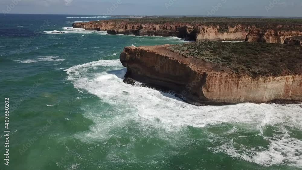 AERIAL - The Great Ocean Road coastline being eroded away by the sea AERIAL - The Great Ocean Road coastline being eroded away by the sea