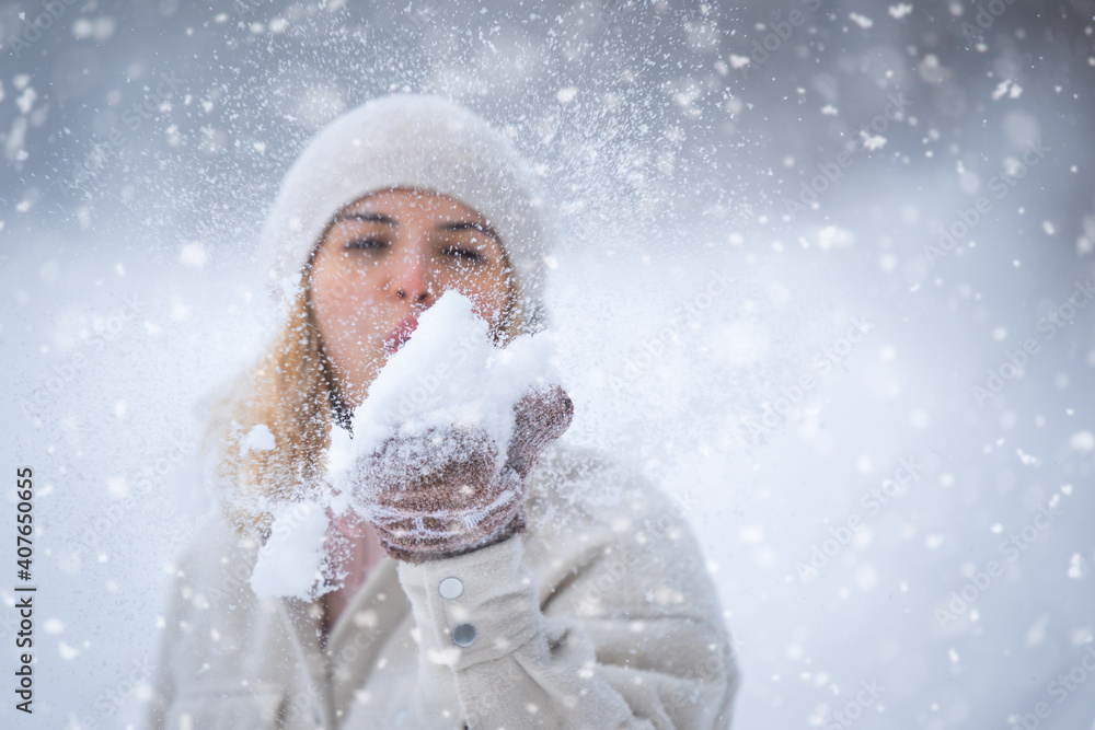 Enjoying winter time woman playing with snow Enjoying winter time woman playing with snow