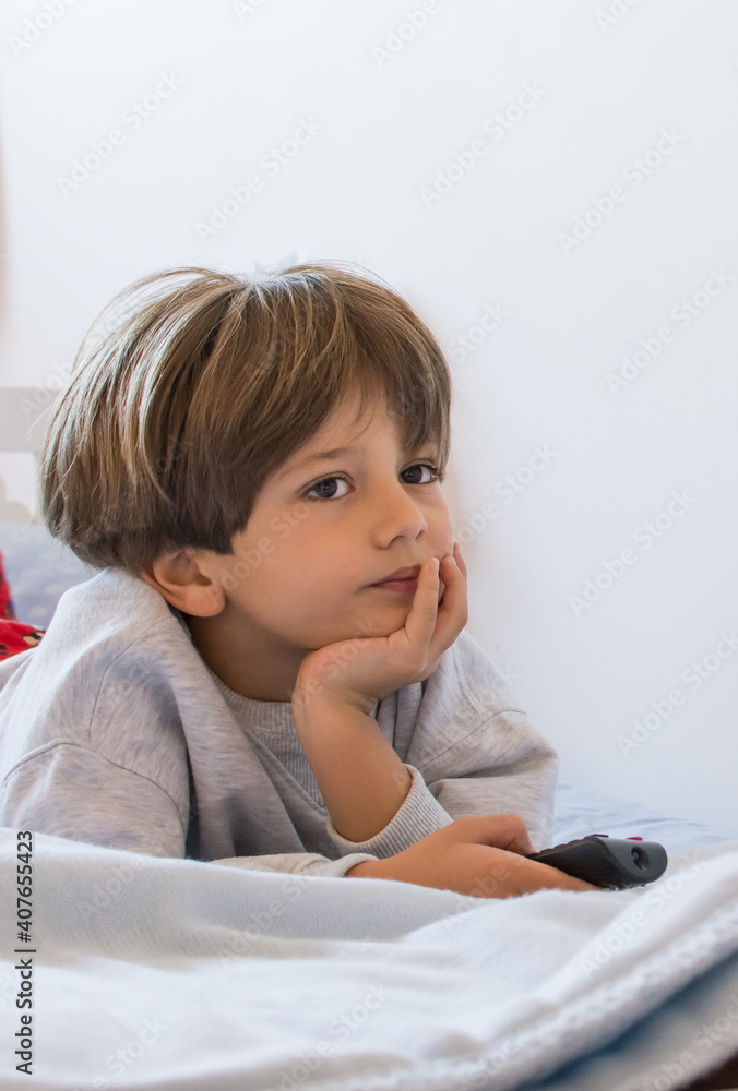 Little Boy Watching Tv.
Cute Little Boy Resting On Bed Mesmerized And Relaxing While Watching Tv. Little Boy Watching Tv.
Cute Little Boy Resting On Bed Mesmerized And Relaxing While Watching Tv.