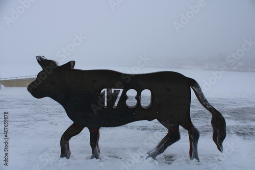 black metal bull in winter with date 1780