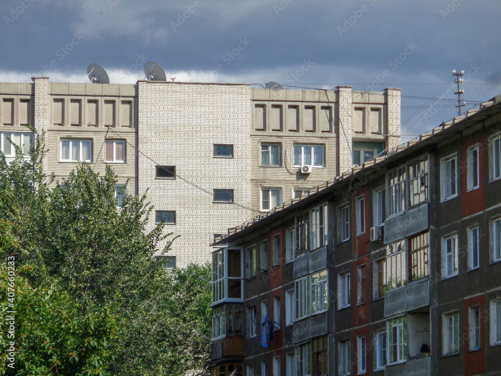 Naklejka premium Soviet architecture. Ust-Kamenogorsk (Kazakhstan) Apartment buildings. Soviet architectural style. Residential buildings. Soviet built multistory apartment buildings. Residential area