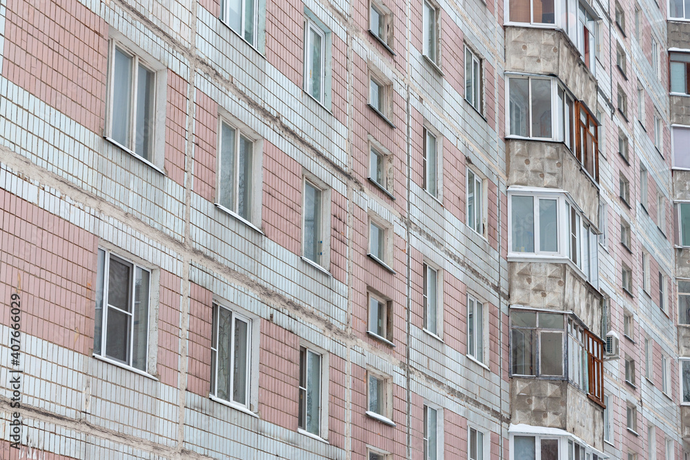 Fototapeta premium The facade of a residential building requiring cosmetic repairs