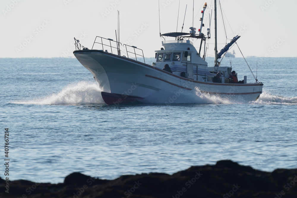 fishing boat returns to port