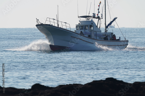 fishing boat returns to port