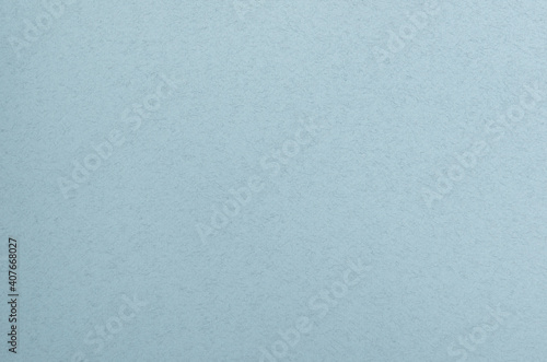 Blue grainy paper background, design element.