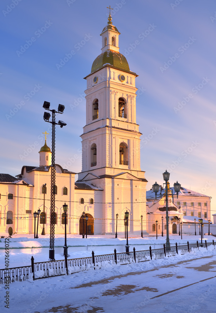 Naklejka premium Tobolsk Kremlin on a winter evening. The bell tower of the St. Sophia Assumption Cathedral in the evening light. Old Russian architecture of the XVII century in the first capital of Siberia