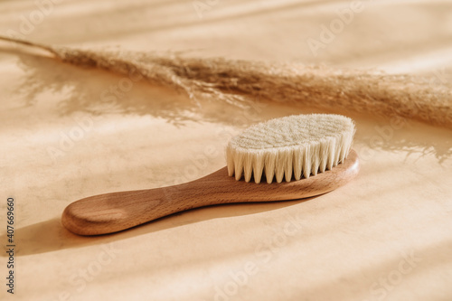 Natural soft goat bristle hair and pampas grass on beige background. Zero waste, eco friendly cosmetics concept. Vintage color filter © Augustas Cetkauskas