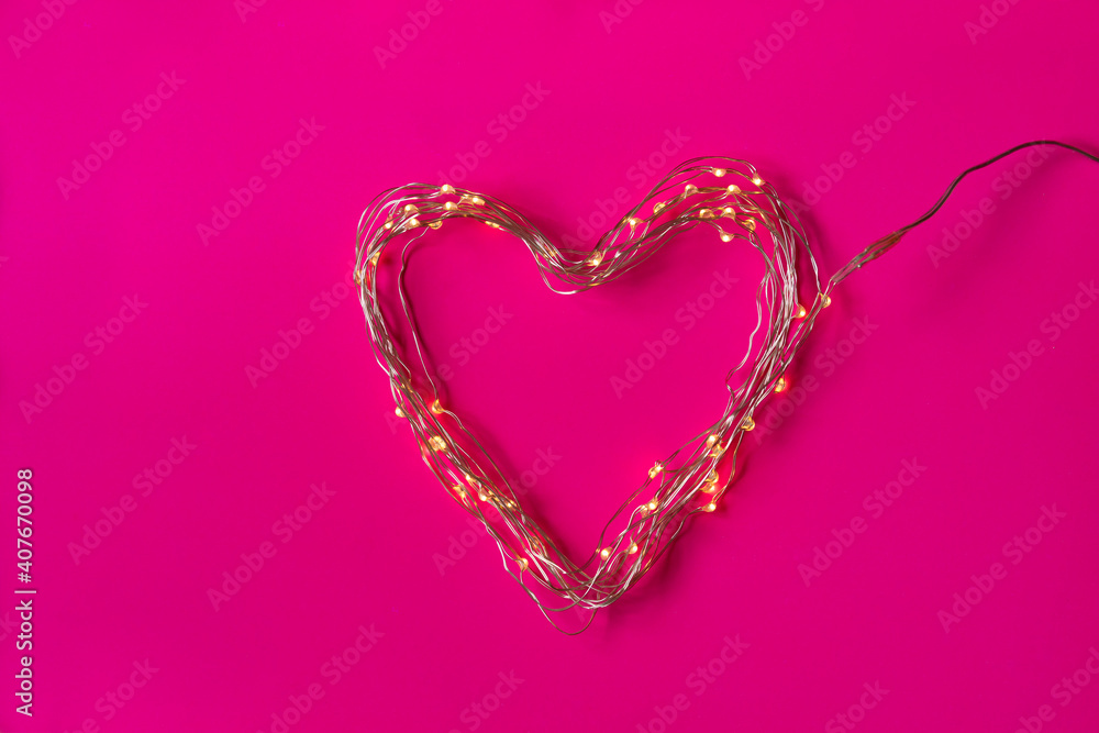 Heart of led lights, perfect for lovers, for a romantic and full of love Valentine's Day. Plain fuchsia pink background. Heart of led lights, perfect for lovers, for a romantic and full of love Valentine's Day. Plain fuchsia pink background.