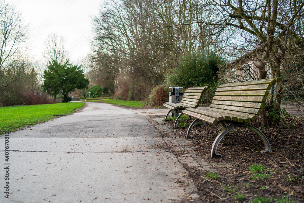 Empty benches in a park Empty benches in a park
