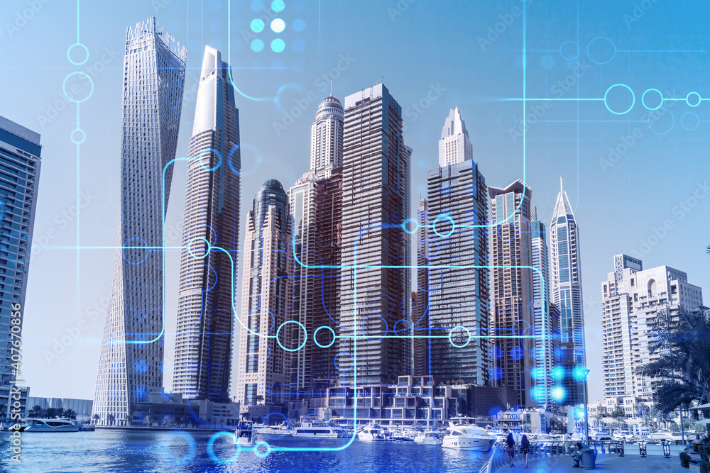 Skyscrapers of Dubai business downtown. International hub of trading and financial services. Technology theme icons hologram, Fintech concept. Double exposure. Dubai Canal waterfront.