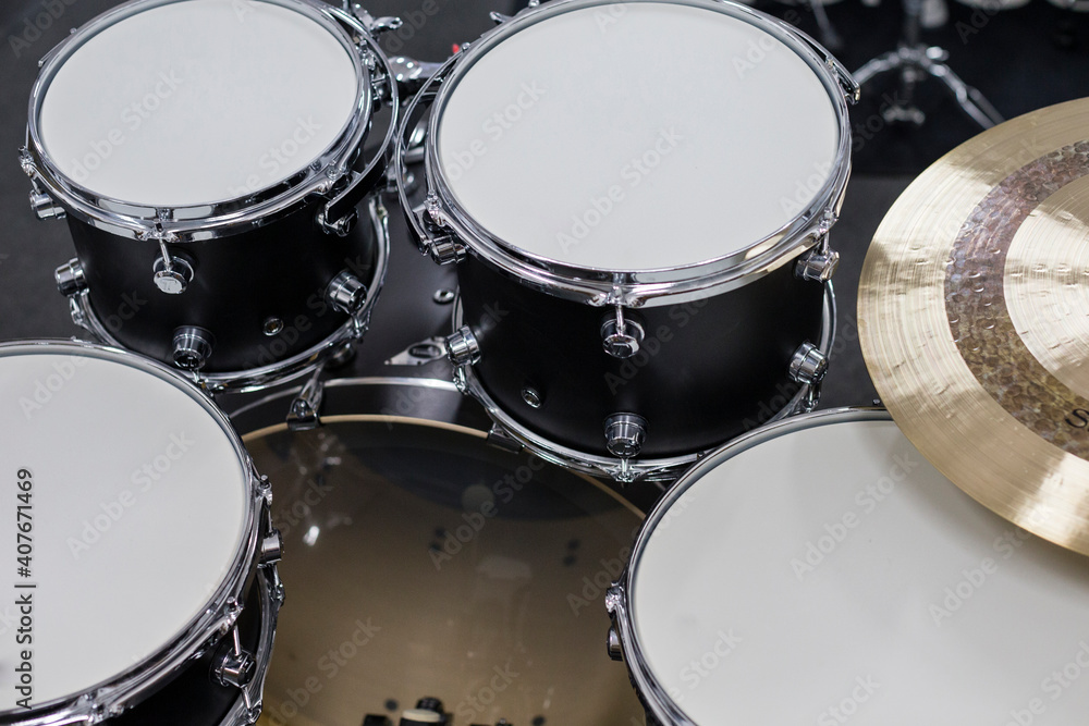 Drums conceptual image. Picture of drums and drumsticks lying on snare drum Drums conceptual image. Picture of drums and drumsticks lying on snare drum