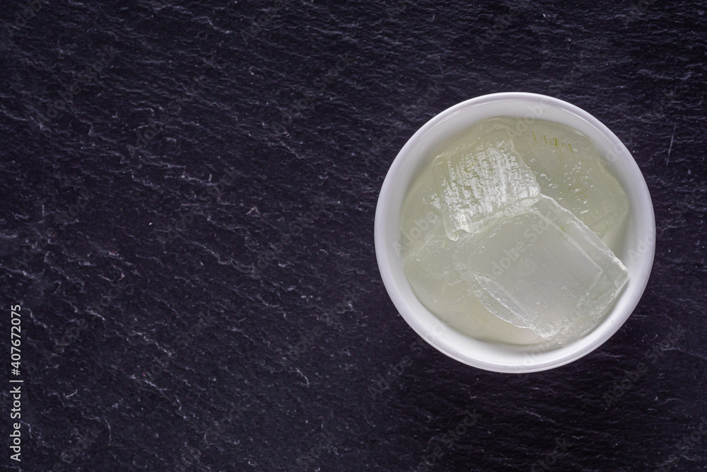 natural aloe vera cream on a dark stone background natural aloe vera cream on a dark stone background