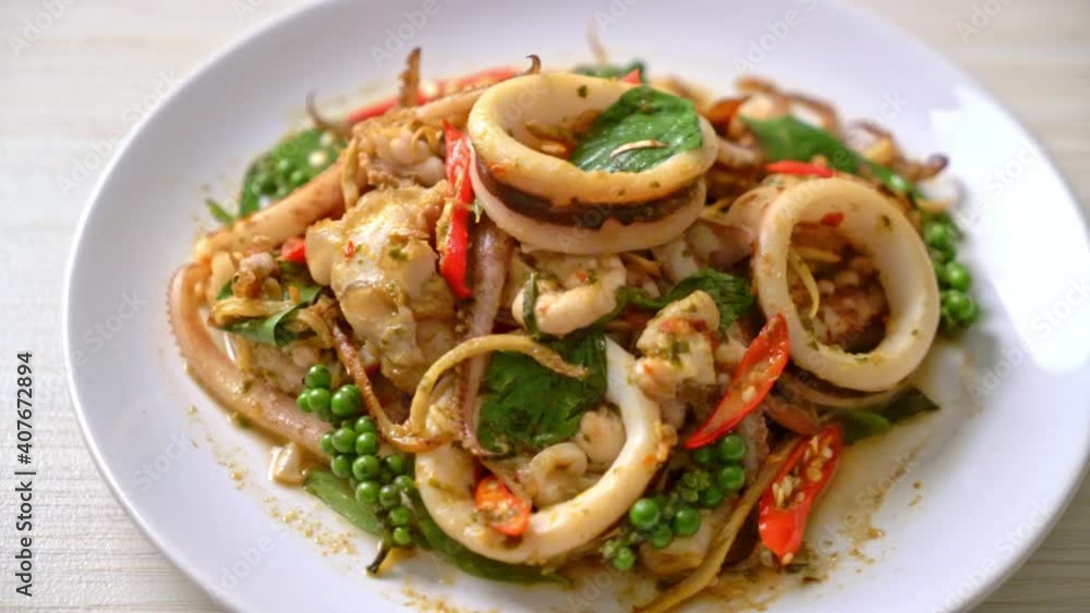 stir fried holy basil with octopus or squid and herb - Asian food style stir fried holy basil with octopus or squid and herb - Asian food style