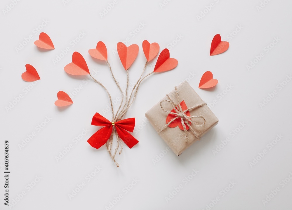 Flat lay Happy Valentine's Day photography with gift box and paper origami heart. Romantic greeting card. Flat lay Happy Valentine's Day photography with gift box and paper origami heart. Romantic greeting card.