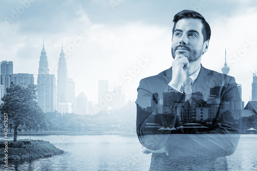 Photography Young handsome businessman in suit with hand on chin thinking how to succeed, new career opportunities, MBA