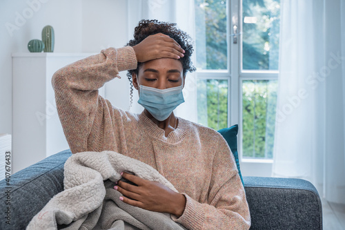 Fototapeta Ill african woman portrait with flu infection at home