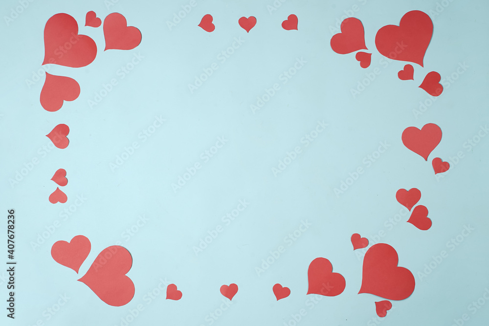 Heart shaped paper sticked on blue background. Emblem of love for happy women, beloved mother, birthday cards and valentine greeting designs. Valentine's day backgrounds. Templates to convey our love.