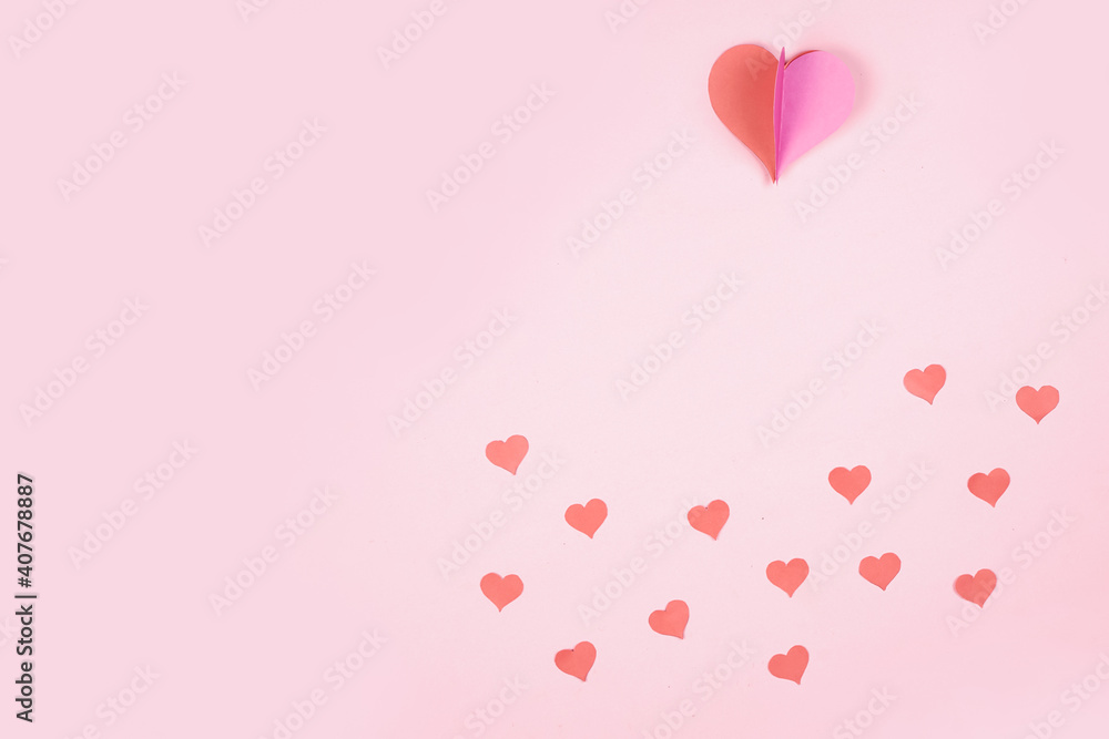 Heart shaped paper sticked on pink background. Emblem of love for happy women, beloved mother, birthday cards and valentine greeting designs. Valentine's day backgrounds. Templates to convey our love.