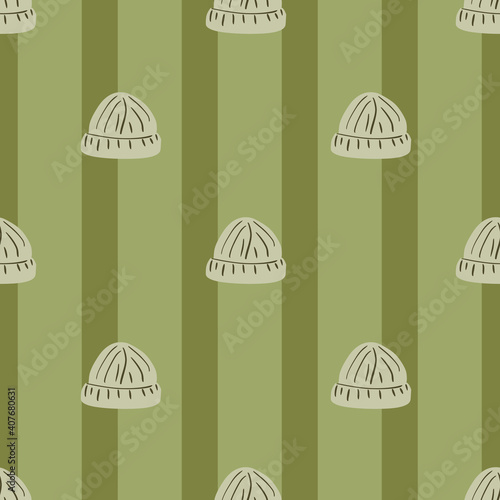 Pale seamless pattern with hand drawn grey simple beanie hat print. Pastel green striped background.