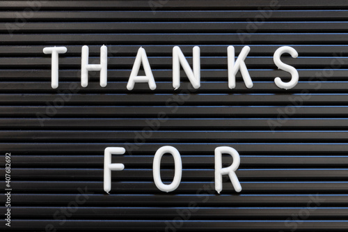 Thanks For in white text on a black striped background for thanking and appreciation.
