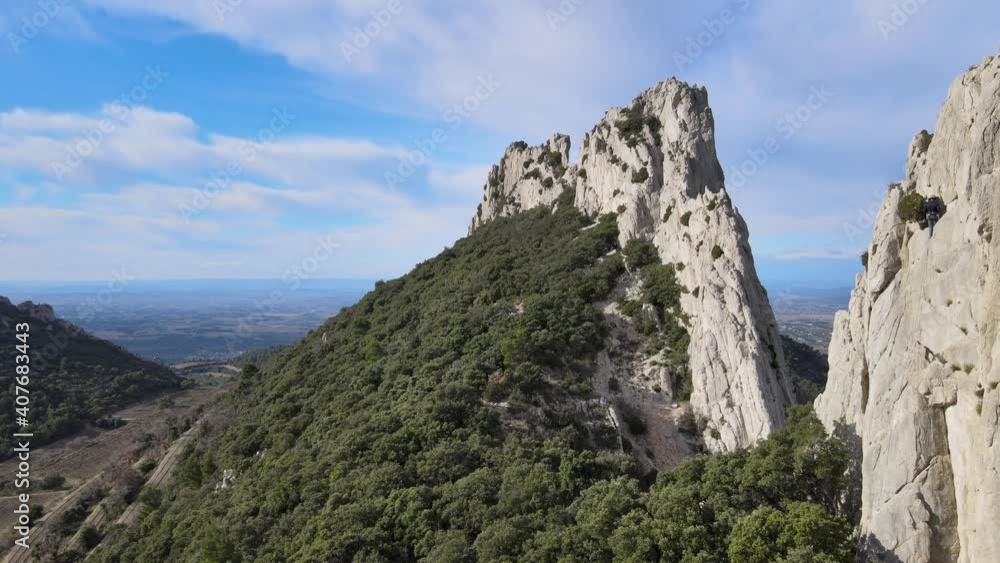 Aerial fly over view of Les Dentelles de Montmirail cliffs in the french alps Aerial fly over view of Les Dentelles de Montmirail cliffs in the french alps