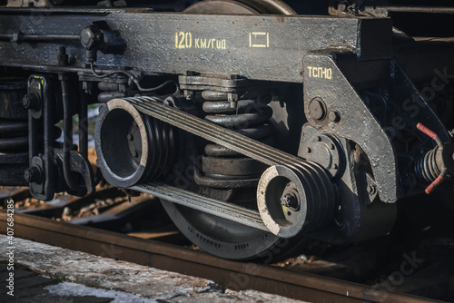 Truskavets, Ukraine - January 2021: Wheels of locomotive CHS7 with a freight train awaiting departure on the platform of the railway station. Ukrzaliznytsia. Ukrainian railways.