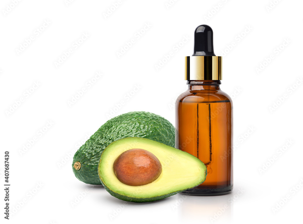 Avocado essential oil with fruit and sliced isolated on white background. Avocado essential oil with fruit and sliced isolated on white background.