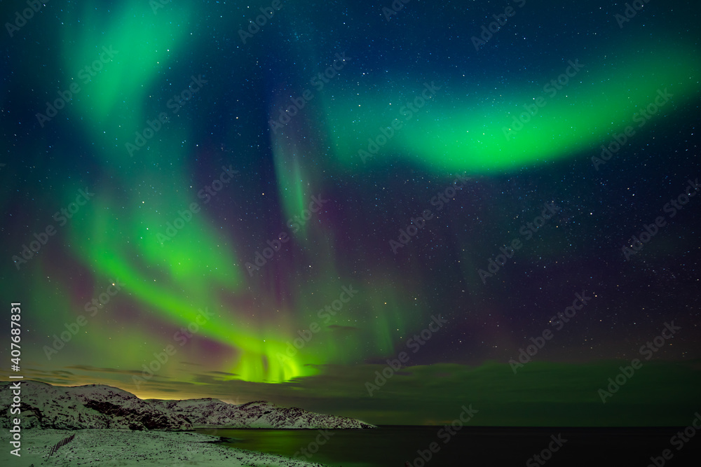 Northern lights (Aurora borealis) in the sky over the Barents Sea