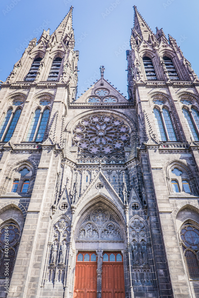 low angle shot of the facade of the gothic cathedral of Clermont-Ferrand, in Auvergne, France