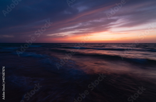 Dark Sunset over the sea shore  sandy beach  colorful sky