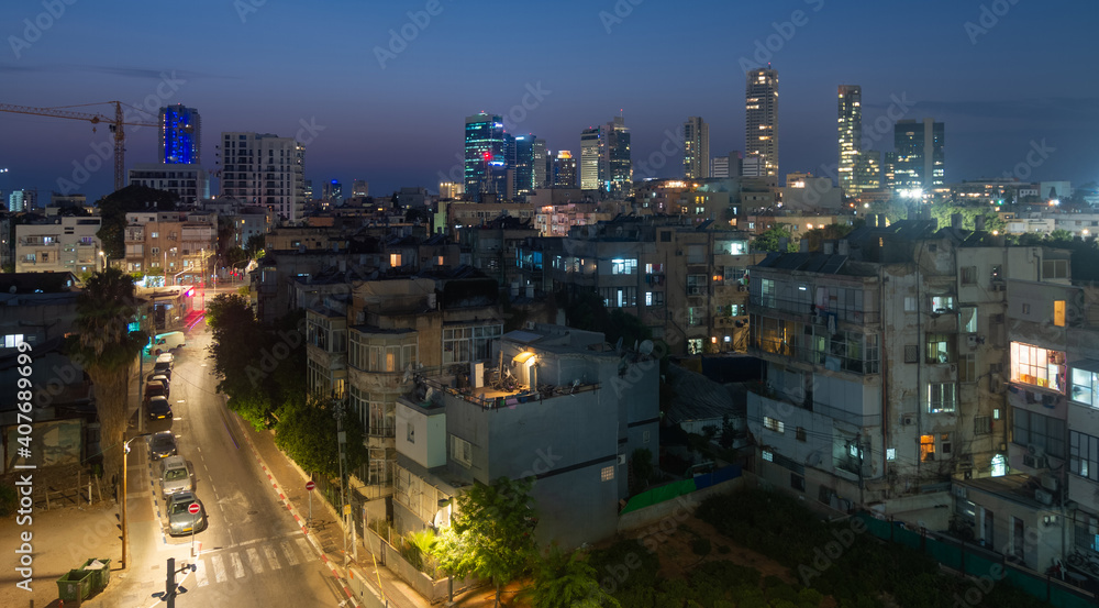 Tel Aviv contrasts: old quarters and modern skyscrapers at night