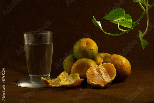 Fresh oranges on a brown background