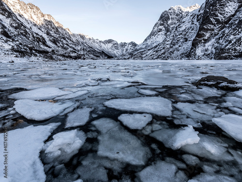 Winter landscape on a lake during Lofoten islands winter. Snow and ice melting © Eric Isselée