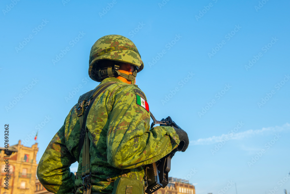 Raising Flag Guard of Honor standing on Zocalo at Historic center of Mexico City CDMX, Mexico. Historic center of Mexico City is a UNESCO World Heritage Site since 1987. Raising Flag Guard of Honor standing on Zocalo at Historic center of Mexico City CDMX, Mexico. Historic center of Mexico City is a UNESCO World Heritage Site since 1987.