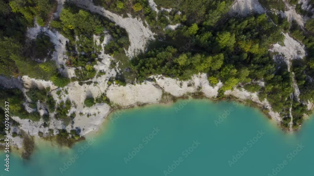 The camera looks down and makes a circular panorama over the sandy shore, which is washed by azure water. View of a beautiful island. The camera looks down and makes a circular panorama over the sandy shore, which is washed by azure water. View of a beautiful island.
