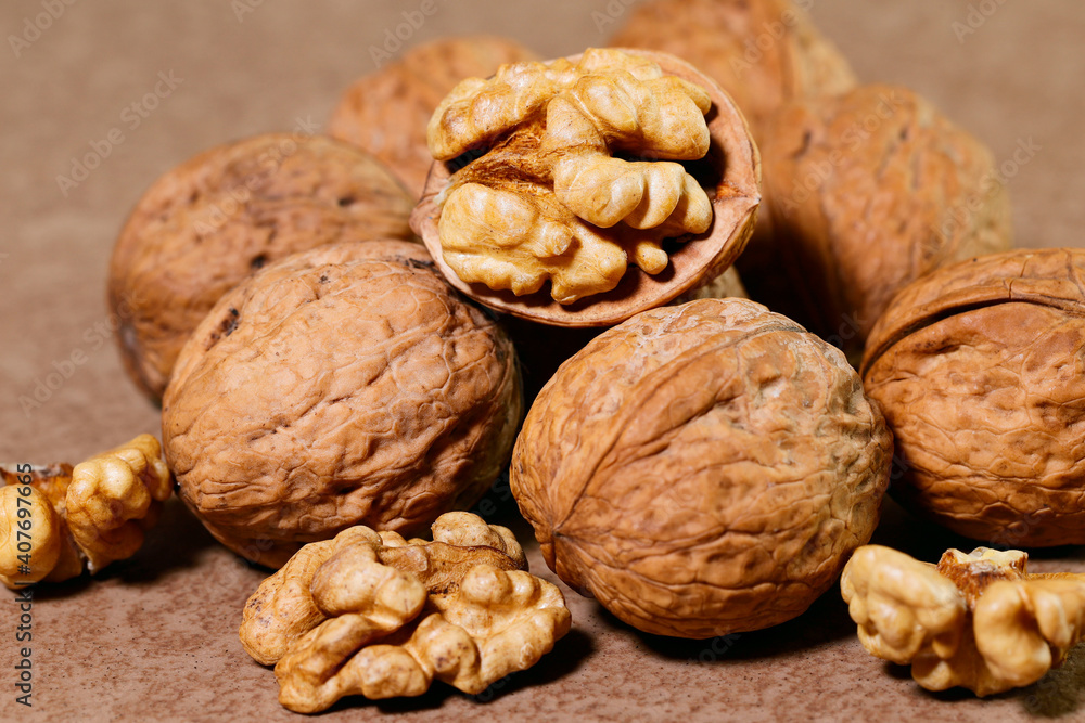 Food background. Walnut kernels close-up. Chopped nuts lie on a wooden table. Food background. Walnut kernels close-up. Chopped nuts lie on a wooden table.