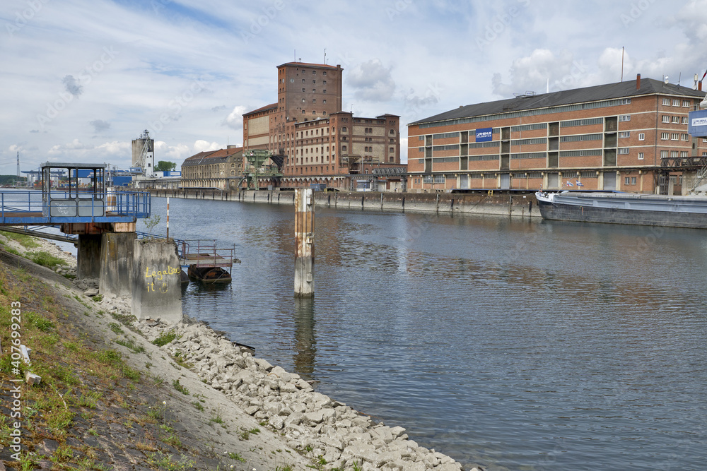 Karlsruhe, Germany: port of Karlsruhe with river rhine, ships, cranes and storage buildings