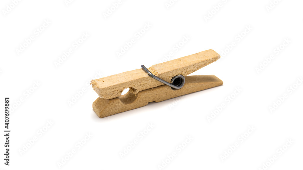 Close-up of an old wooden clothespin isolated on white background. Simple wooden spring device for drying clothes. Close-up of an old wooden clothespin isolated on white background. Simple wooden spring device for drying clothes.