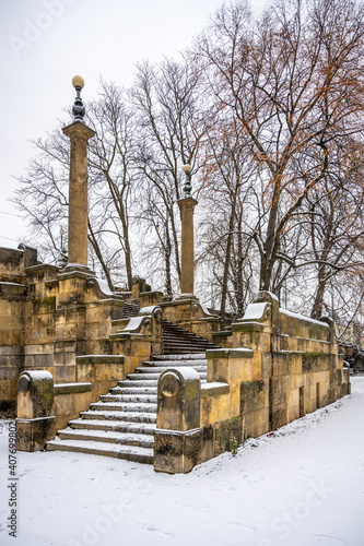 Stone brige staircase covered by snow photo