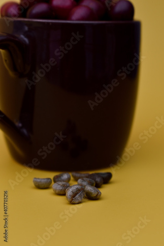 Ripened and unripe coffee beans fresh from the farm. Red, light green, yellow, orange  beans. Coffee seeds are used in latte mocha frap cappuccino and other caffeine caffeinated drinks. tropical plant photo