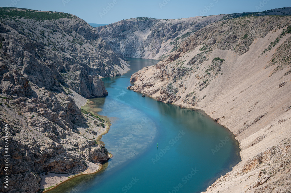 Woman enjoy the view - top of a mountain in Croatia - Landscape with blue river